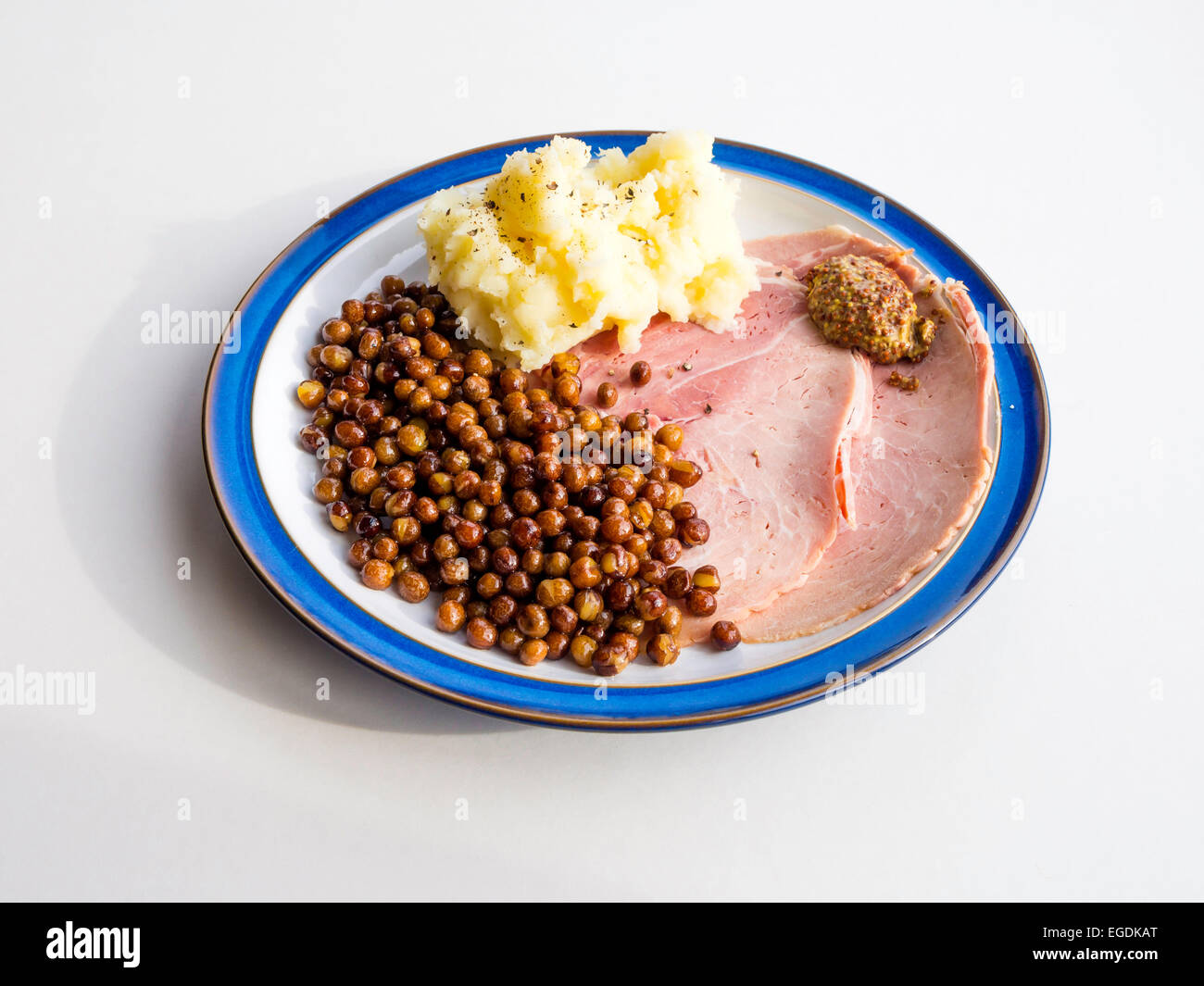 Traditional North of England Carlin or Passion Sunday meal of ham, mashed potatoes and Carlin Peas with Whole Grain Mustard Stock Photo