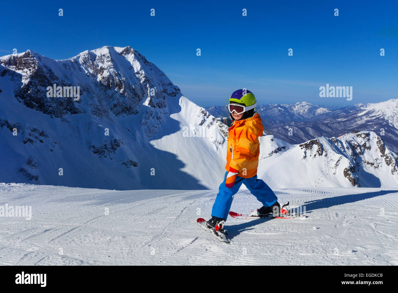 Boy in mask skiing with beautiful mountain view Stock Photo - Alamy