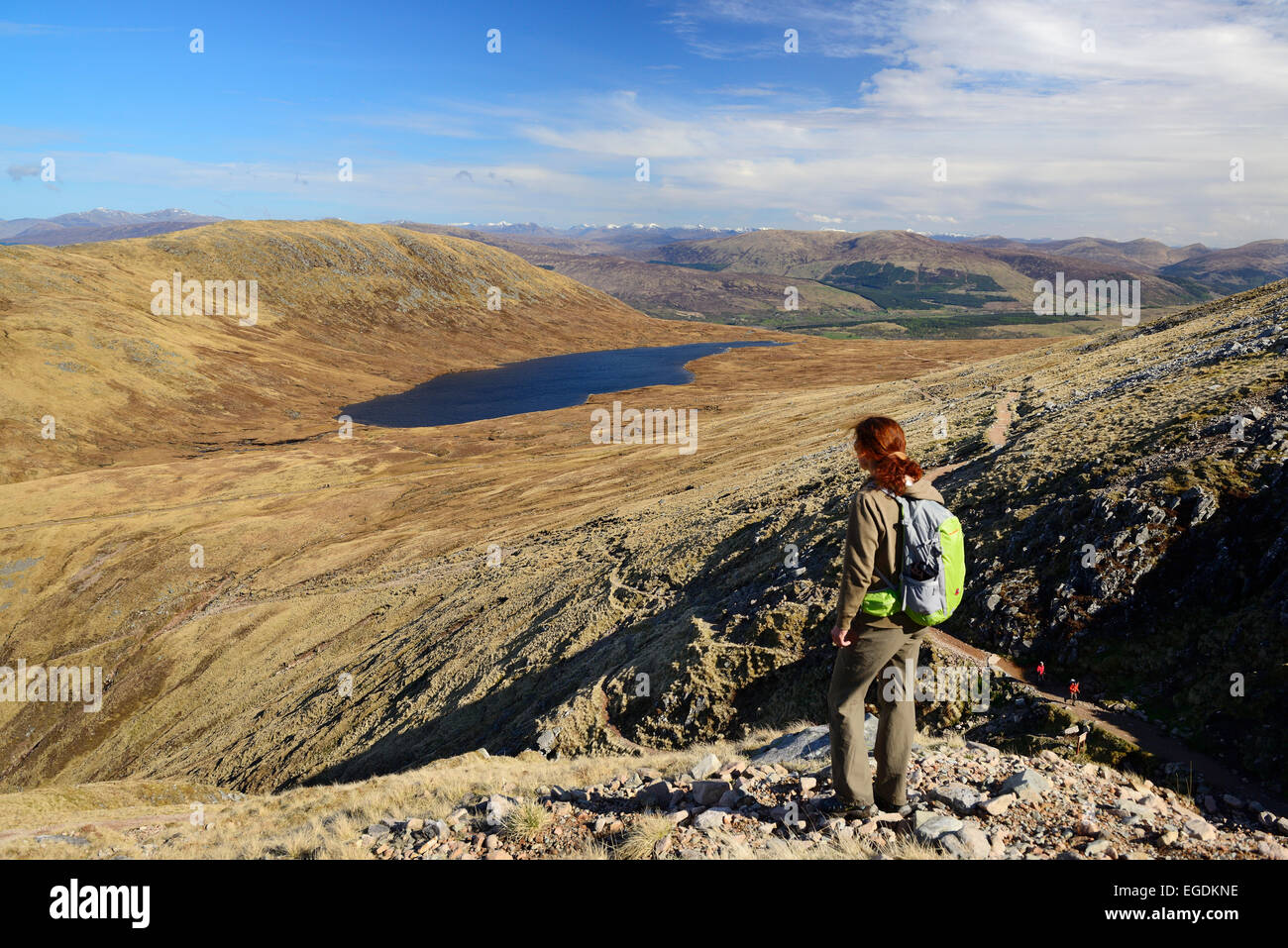 Female hiker looking to Half Way Loch, Ben Nevis, Highlands, Scotland, United Kingdom Stock Photo