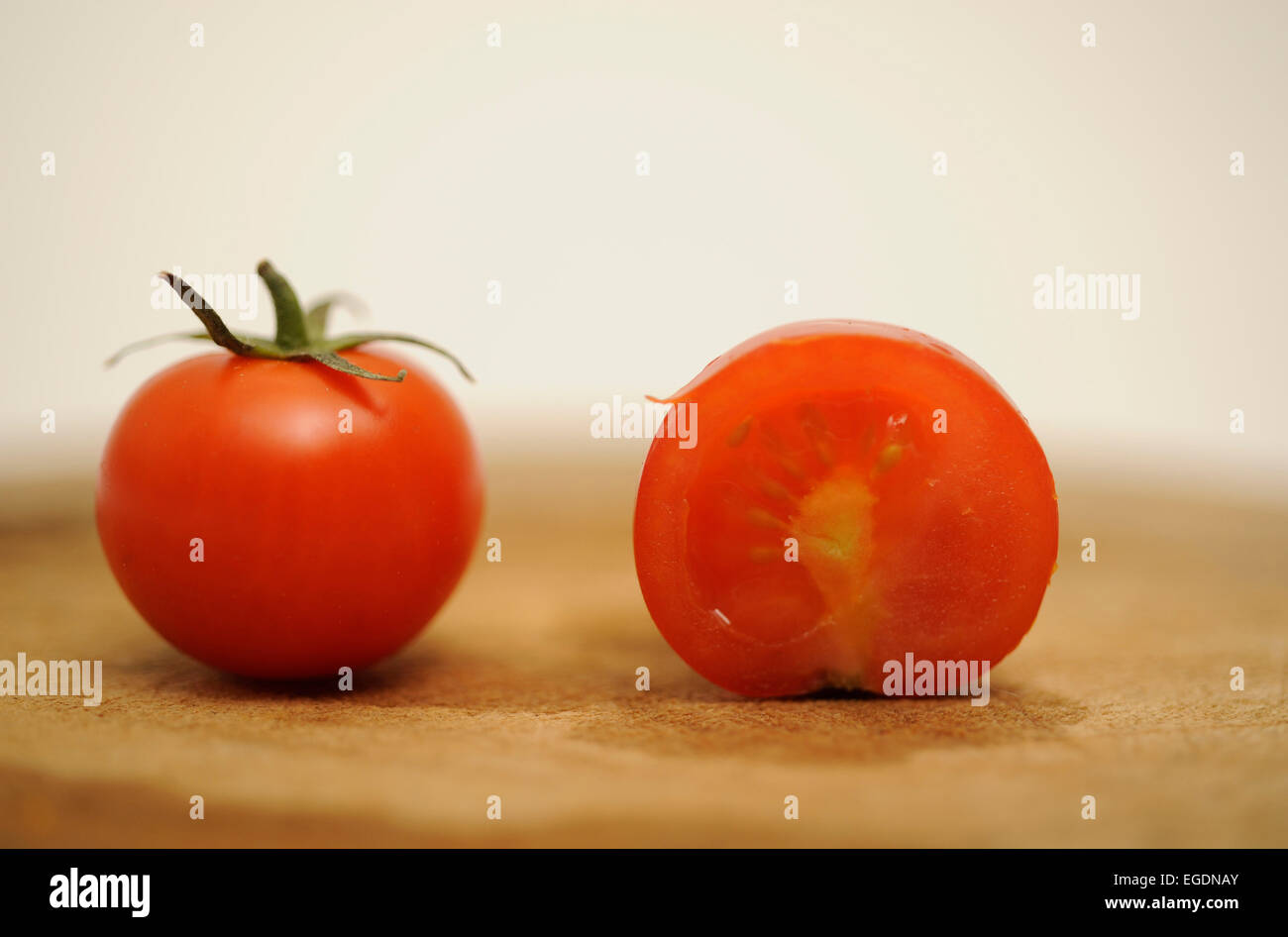 Tomatoes on a Chopping Board Stock Photo - Alamy