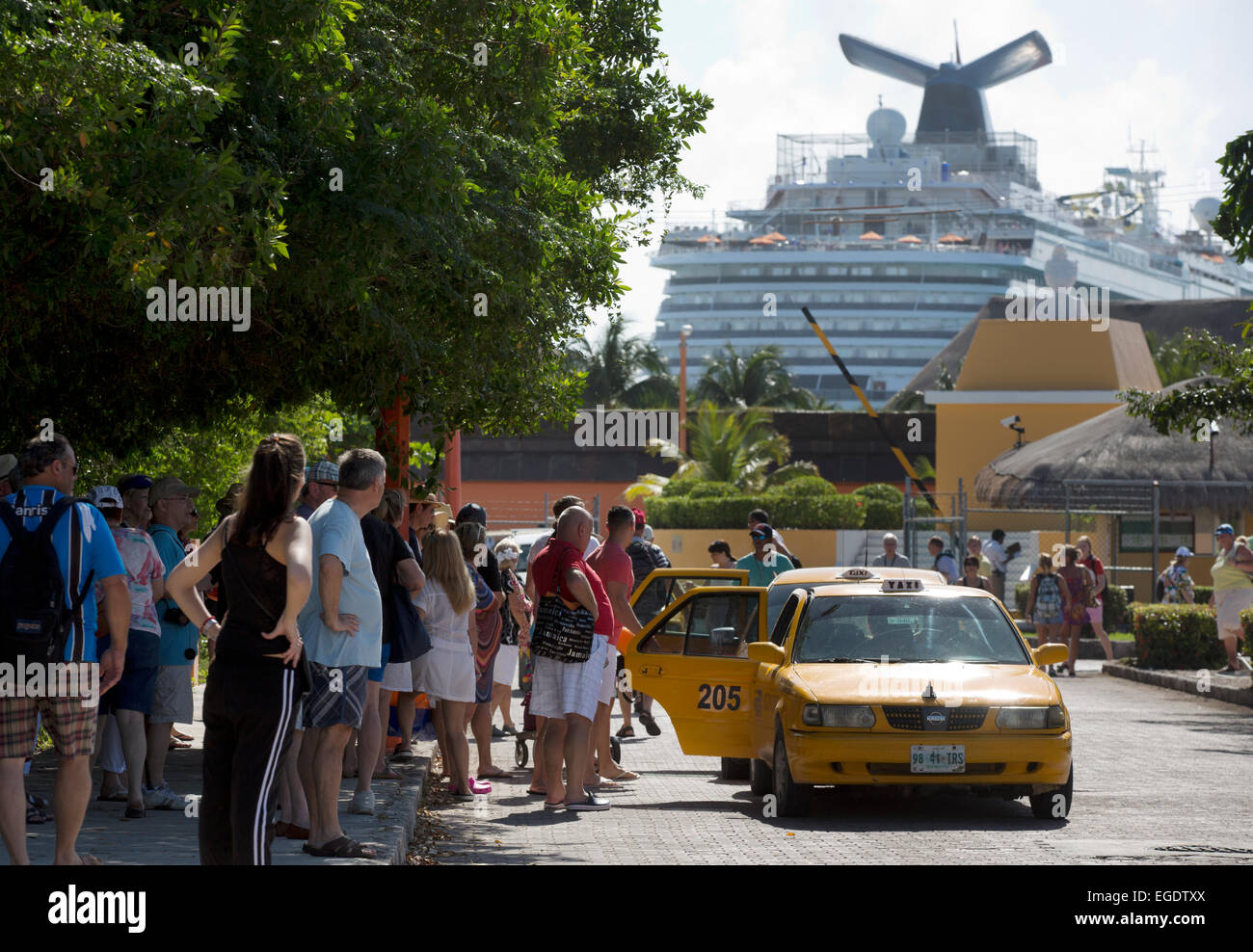 Tourists enter taxis, cruise ship port, Mahahual Quinitana Roo retired retirees ocean front holiday vacation Stock Photo