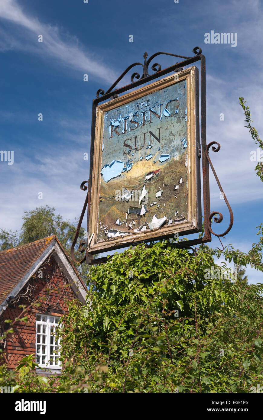 State of the economy sign of the times closing down public houses pubs in rural Kent the rising sun Stock Photo