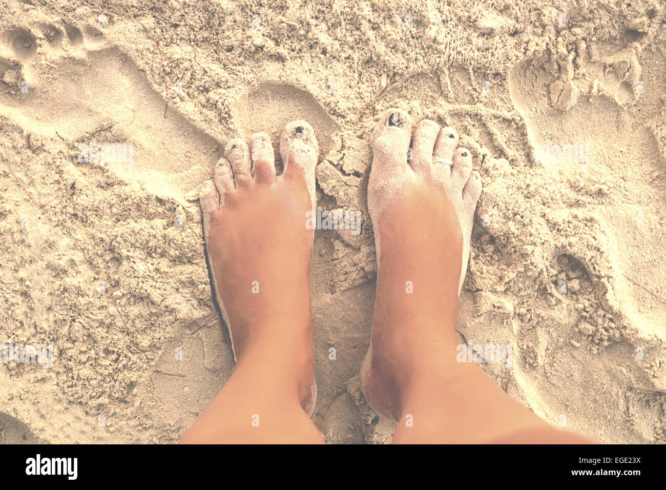 barefoot in the white sand of Otres Beach, Sihanoukville, Cambodia Stock Photo