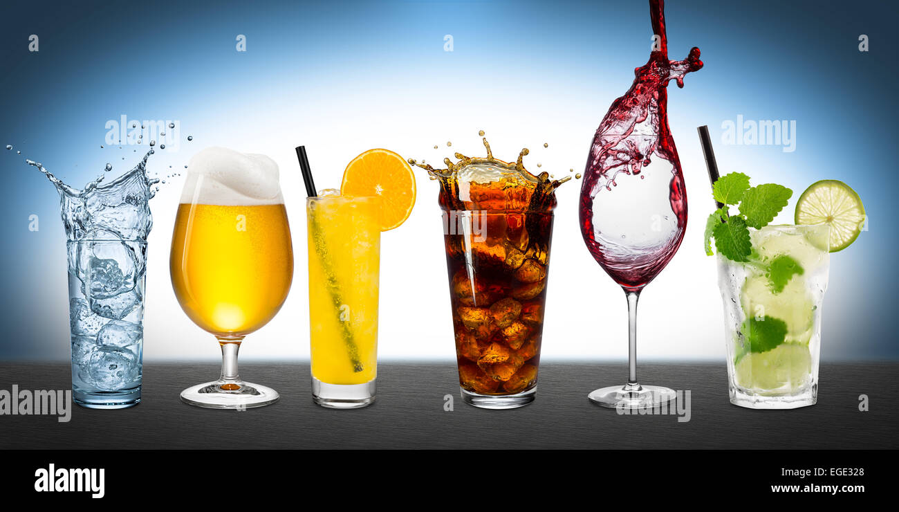 Row of various drinks on blue background Stock Photo