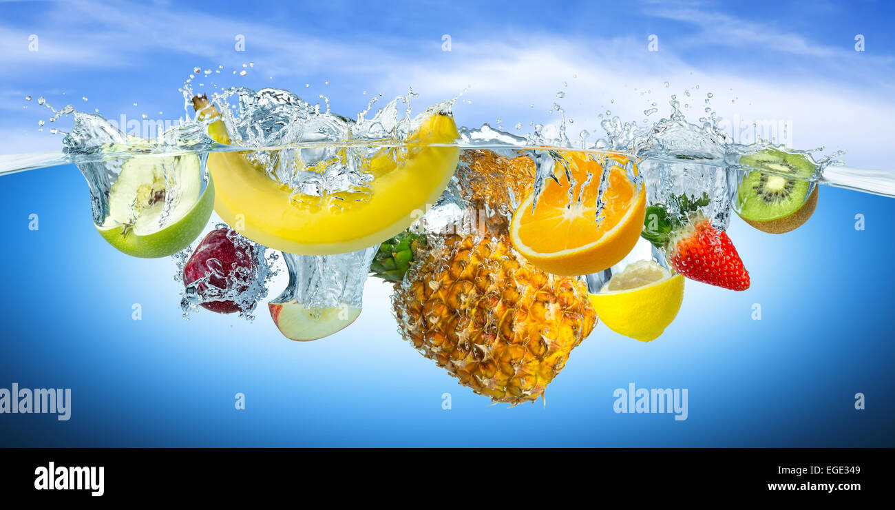 many fruits splashes into water Stock Photo