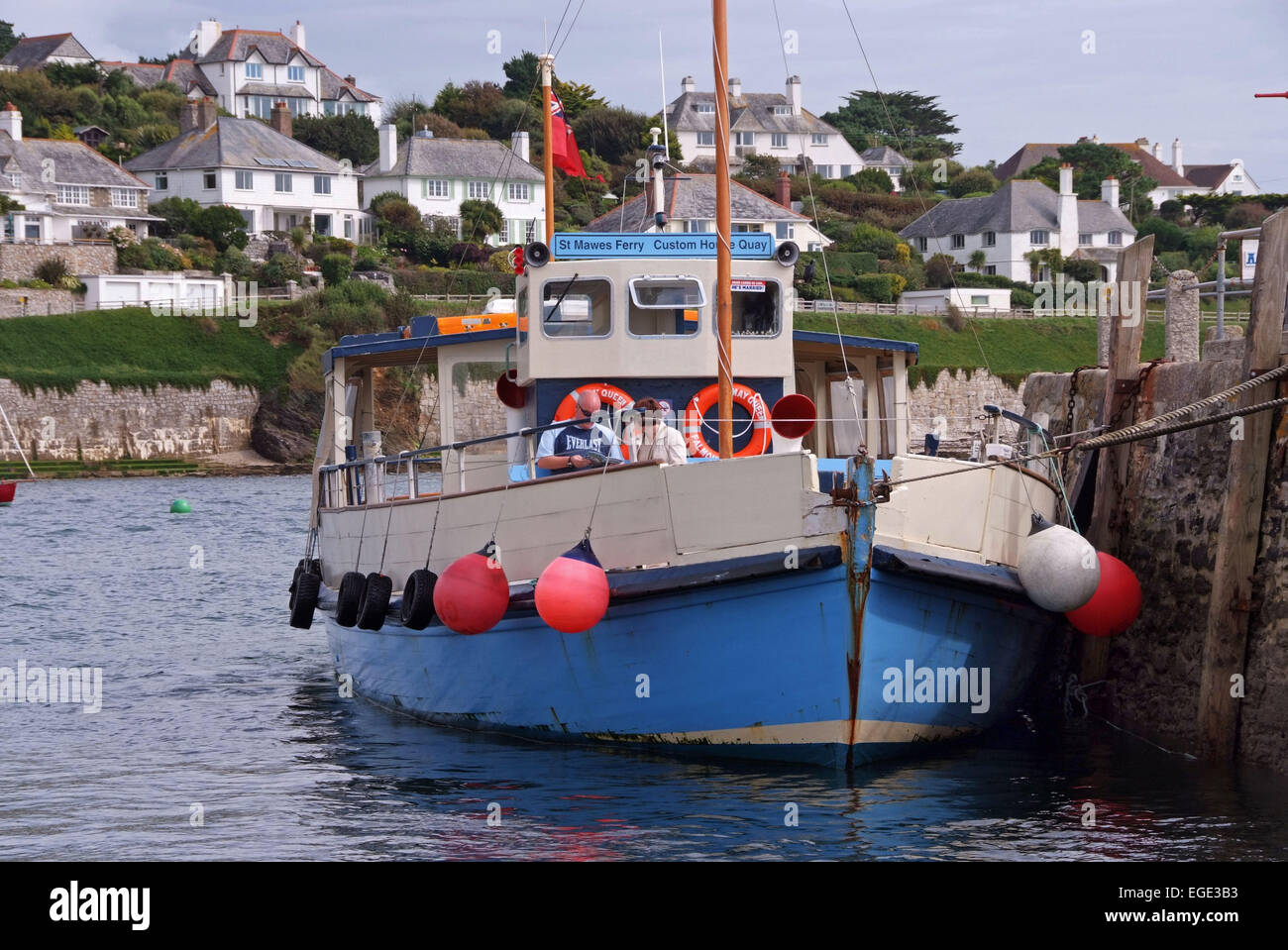 St.Mawes,Cornwall,UK,showing the harbour,boats,seagull,shell seller,shops,cafes,restaurants old garage with old Shell pumps.a UK Stock Photo
