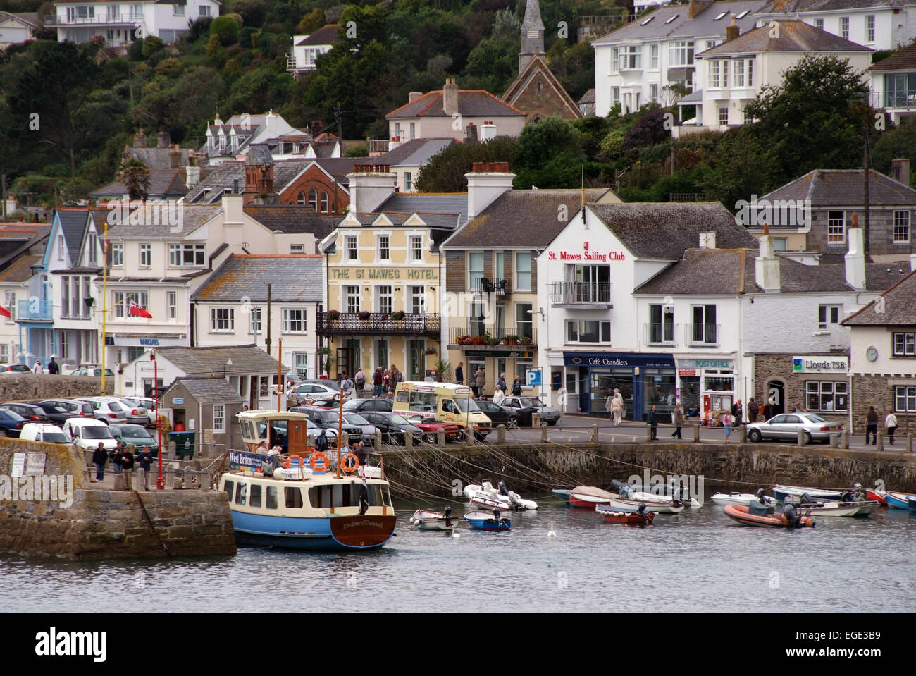 St.Mawes,Cornwall,UK,showing the harbour,boats,seagull,shell seller,shops,cafes,restaurants old garage with old Shell pumps.a UK Stock Photo