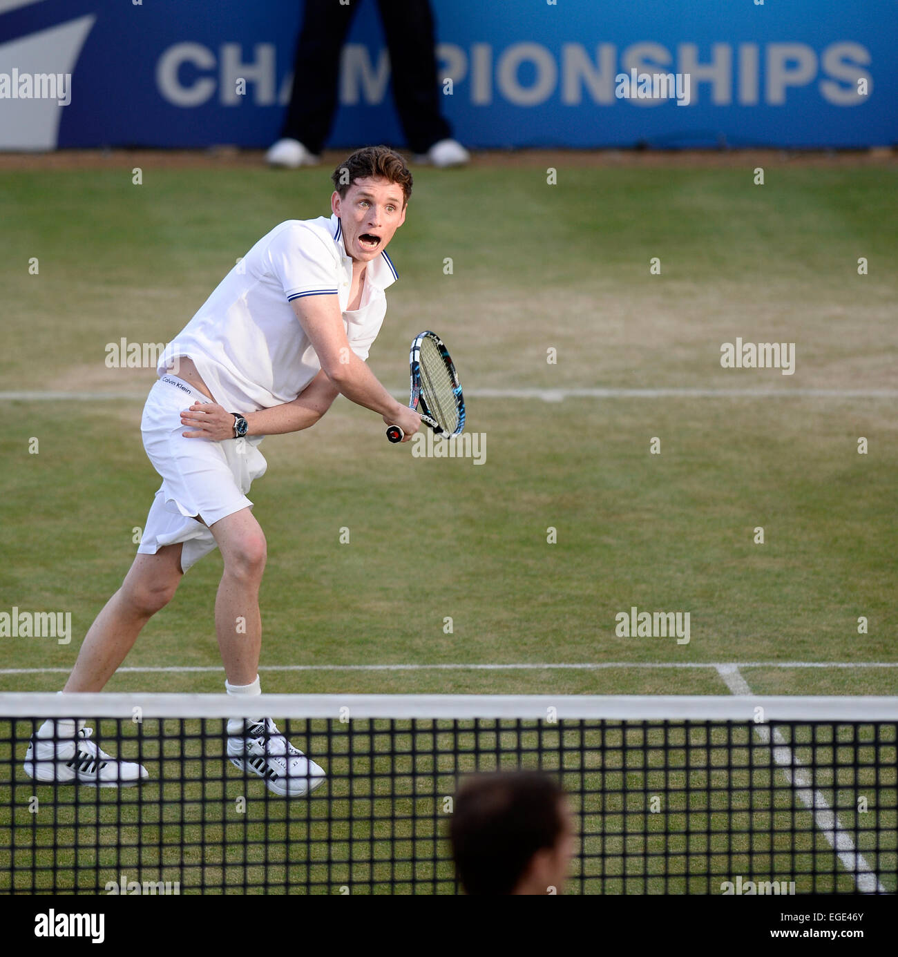 Actor Eddie Redmayne plays tennis during a charity match at Queen's Club in London 2013. Redmayne recently won a Oscar in 2015. Stock Photo