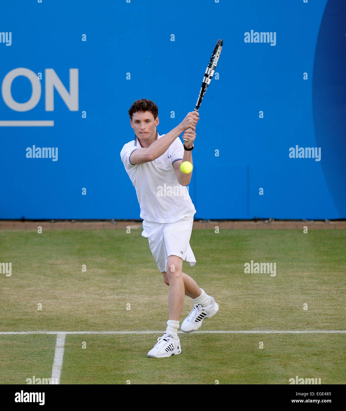 Actor Eddie Redmayne plays tennis during a charity match at Queen's Club in London 2013. Redmayne recently won a Oscar in 2015. Stock Photo
