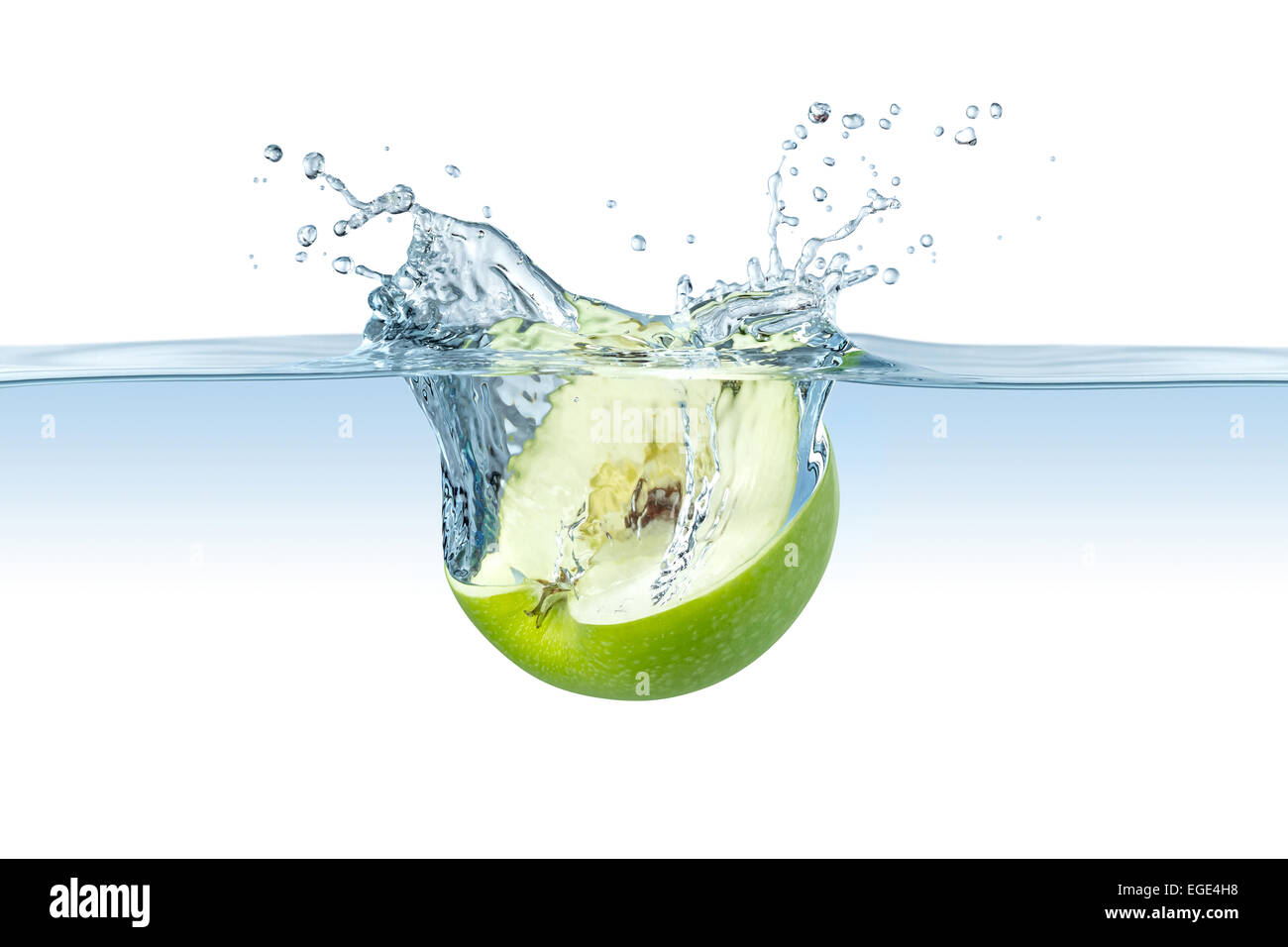 half green apple splashes into water Stock Photo