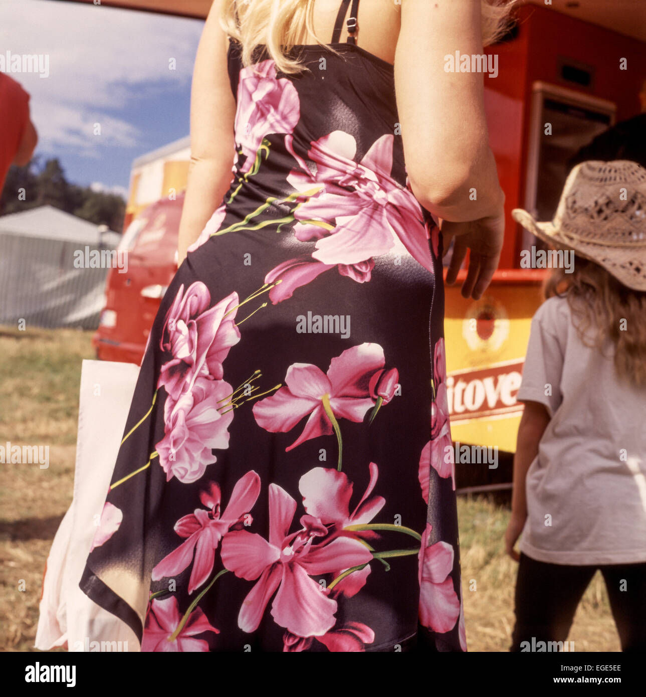 Woman in a flowery dress, summer model Stock Photo