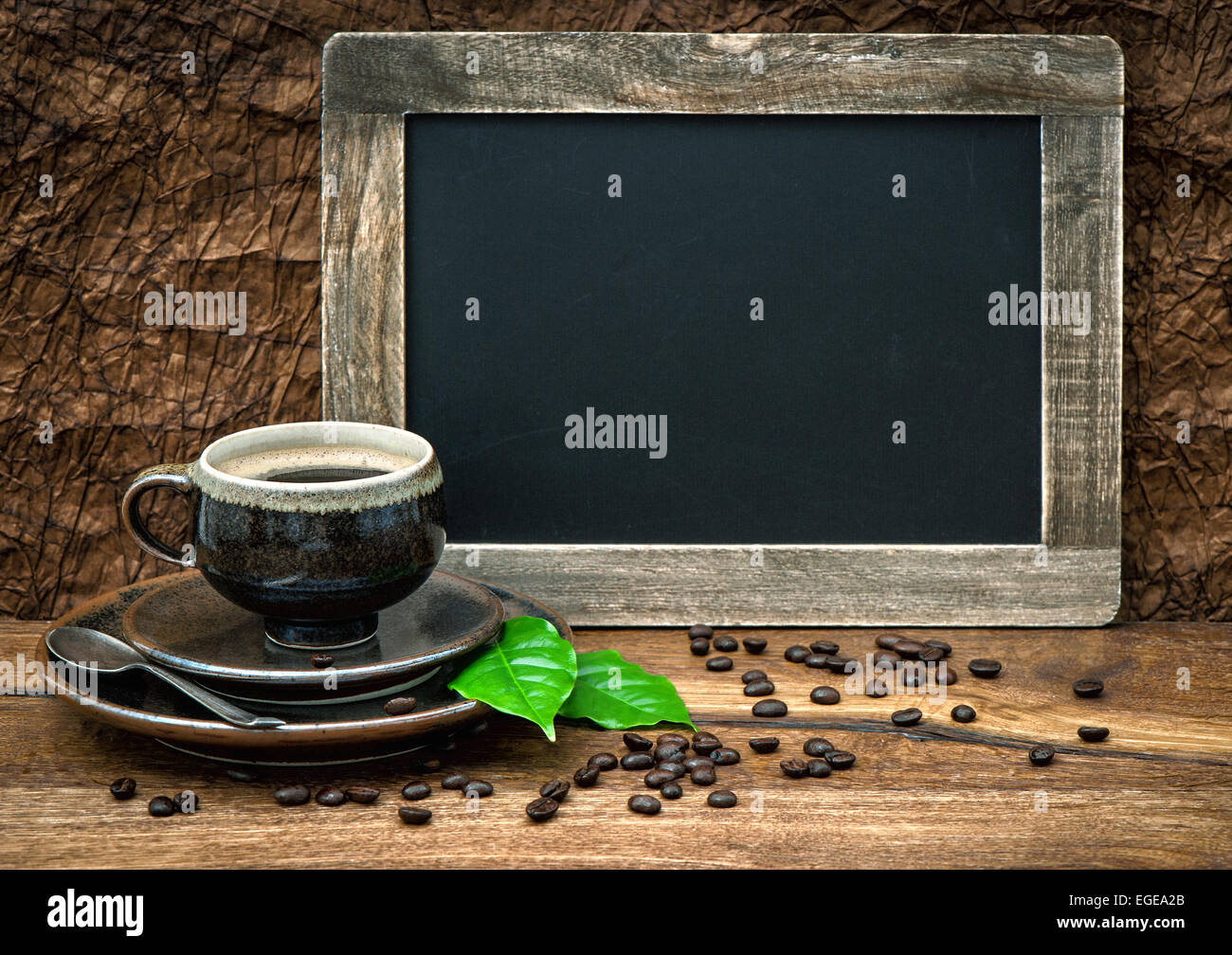 coffee, antique blackboard, coffee leaves and beans. retro style toned image Stock Photo