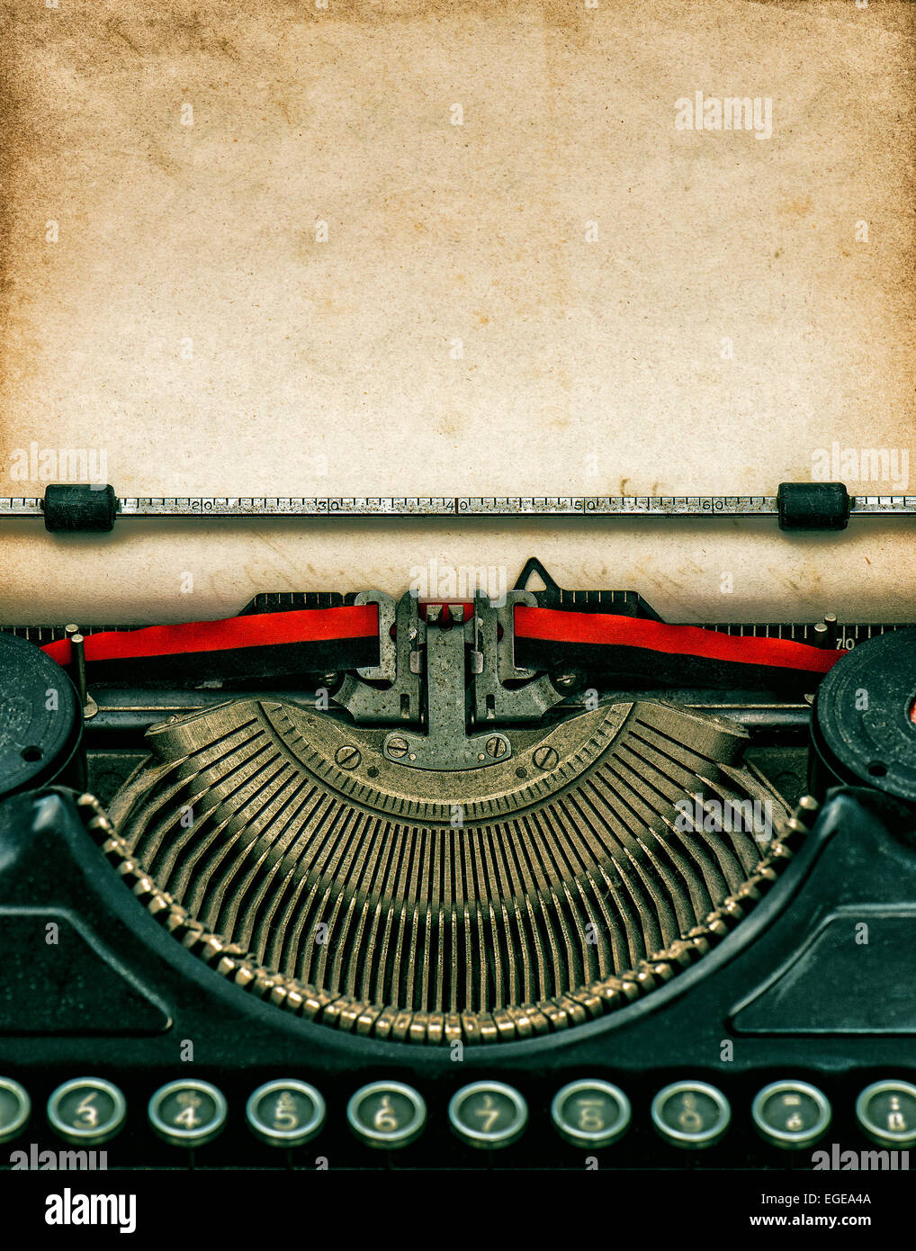 Vintage typewriter with aged textured grungy paper Stock Photo