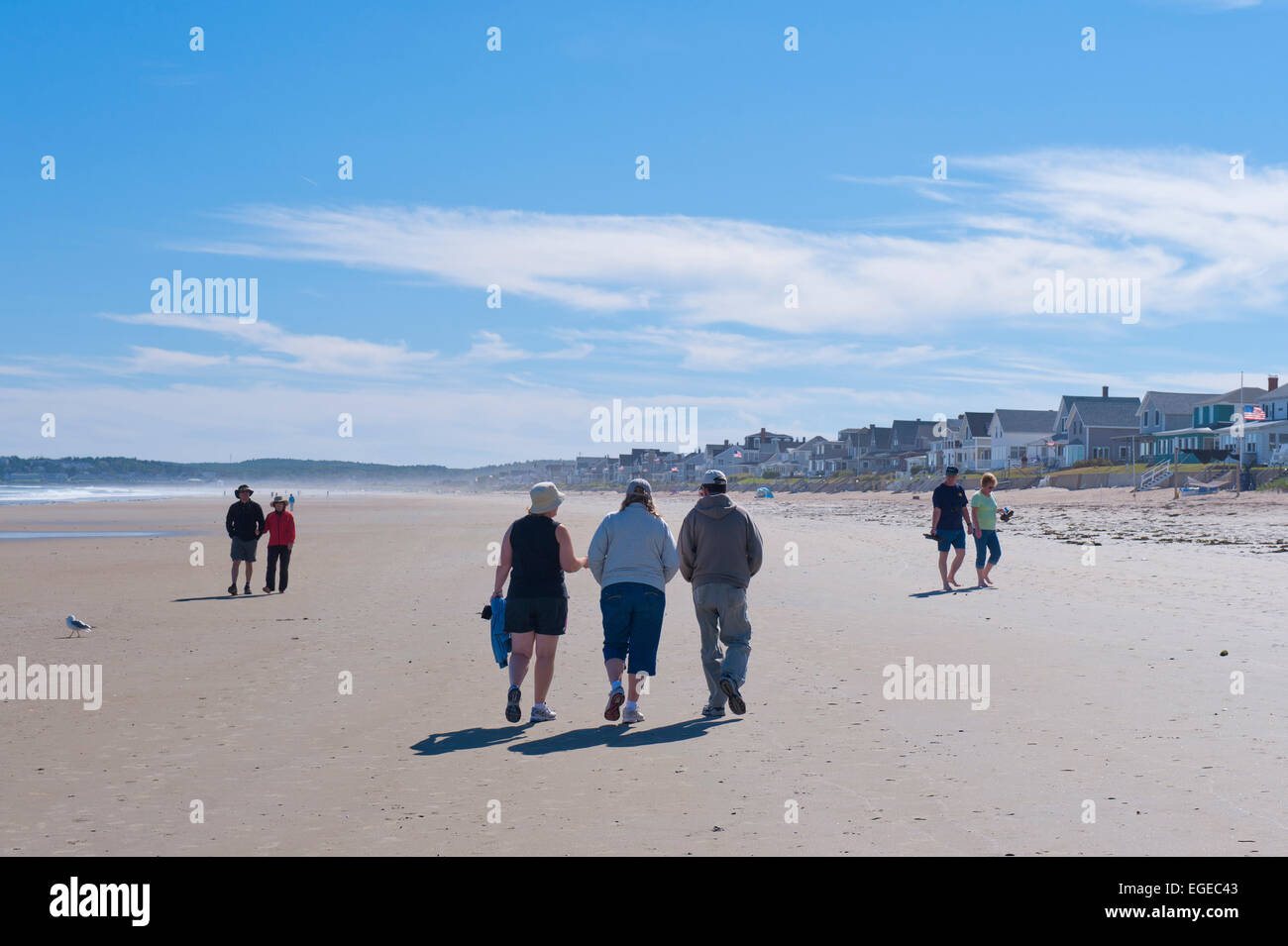 People walking on the beach at low tide. Moody Beach, Maine, USA Stock