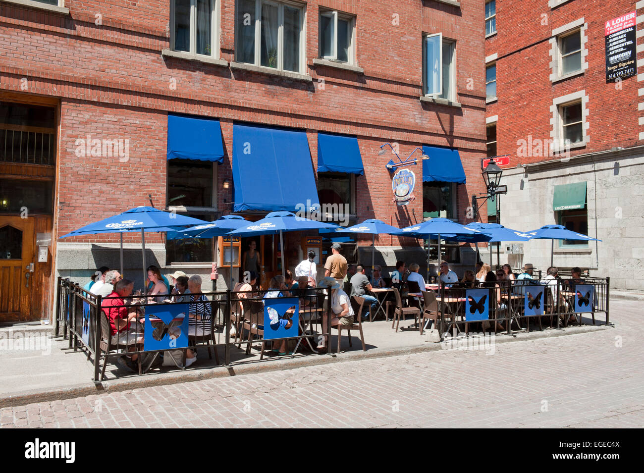People eating on a terrace, Old Montreal, province of Quebec, Canada. Stock Photo