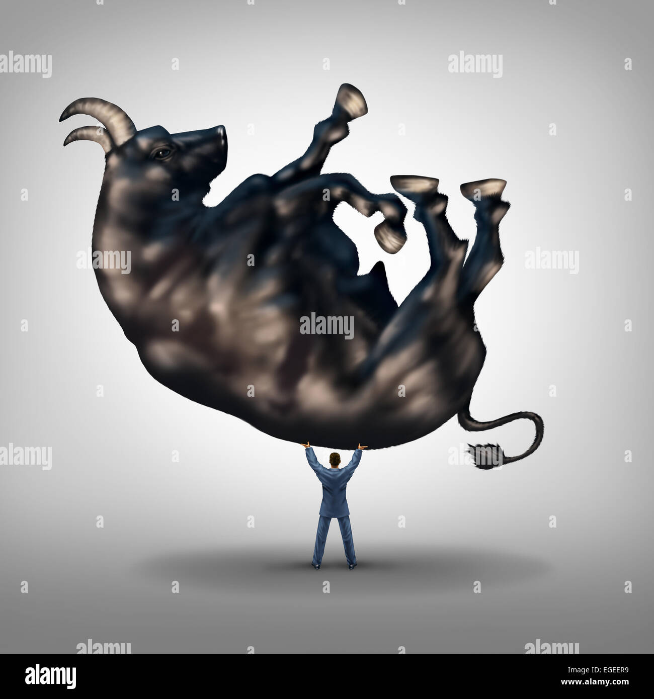 Investing solutions and financial leadership symbol and business success concept as a take charge businessman lifting a giant bull as an icon of a leader with taking control of wealth management. Stock Photo
