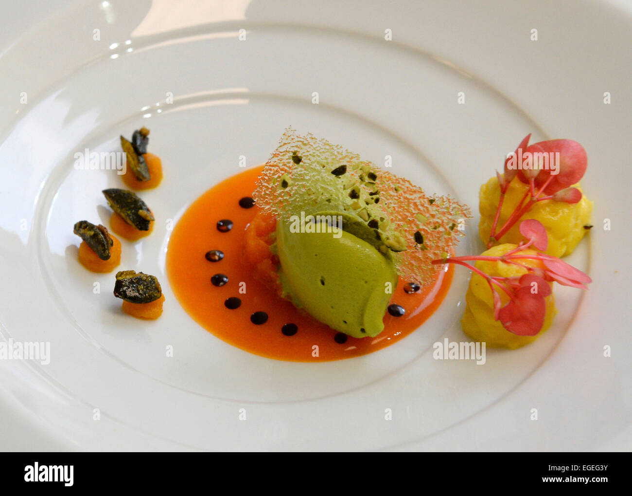 Baiersbronn, Germany. 23rd Feb, 2015. A pumpkin appetizer with an apple blossom garnish from three-star chef Harald Wohlfahrt in the kitchen of the restaurant Traube-Tonbach during CookTank in Baiersbronn, Germany, 23 February 2015. CookTank considers itself a sort of cooking and think tank, in which top chefs, media representatives, producers, and experts develop ideas and strategies for tomorrow's cuisine. Photo: Thomas Kienzle/dpa/Alamy Live News Stock Photo