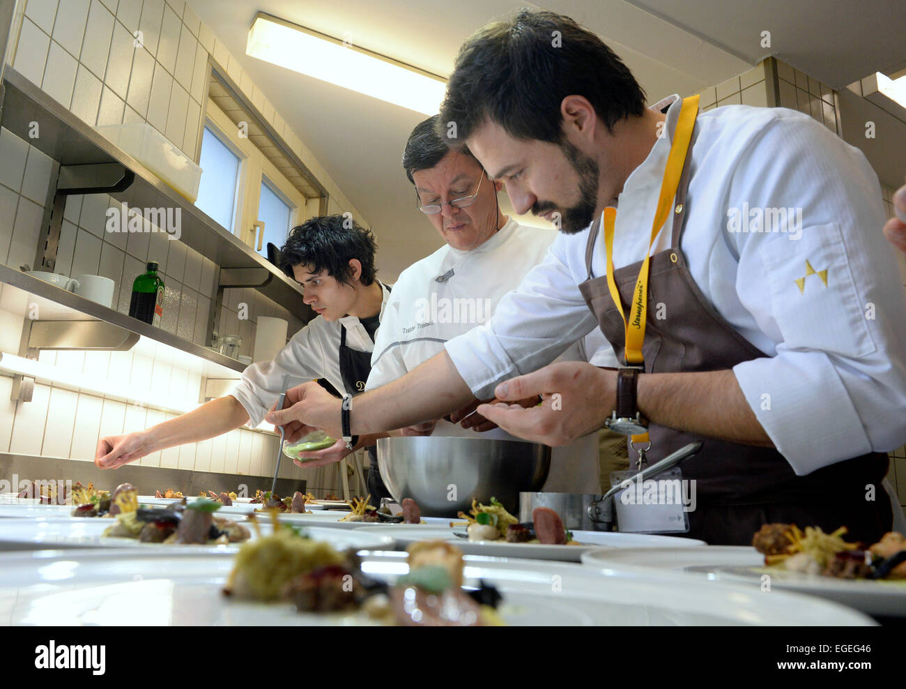 Baiersbronn, Germany. 23rd Feb, 2015. Three-star chef Harald Wohlfahrt (C) with chefs Harald Irka and Christian Geisler in the kitchen of the restaurant Traube-Tonbach during CookTank in Baiersbronn, Germany, 23 February 2015. CookTank considers itself a sort of cooking and think tank, in which top chefs, media representatives, producers, and experts develop ideas and strategies for tomorrow's cuisine. Photo: Thomas Kienzle/dpa/Alamy Live News Stock Photo