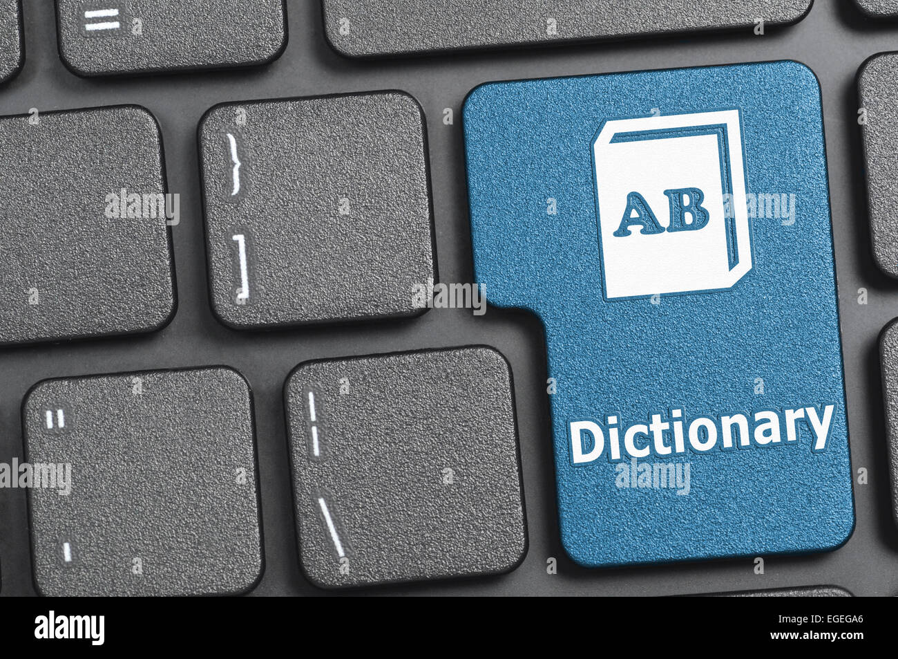 Blue dictionary key on keyboard Stock Photo - Alamy