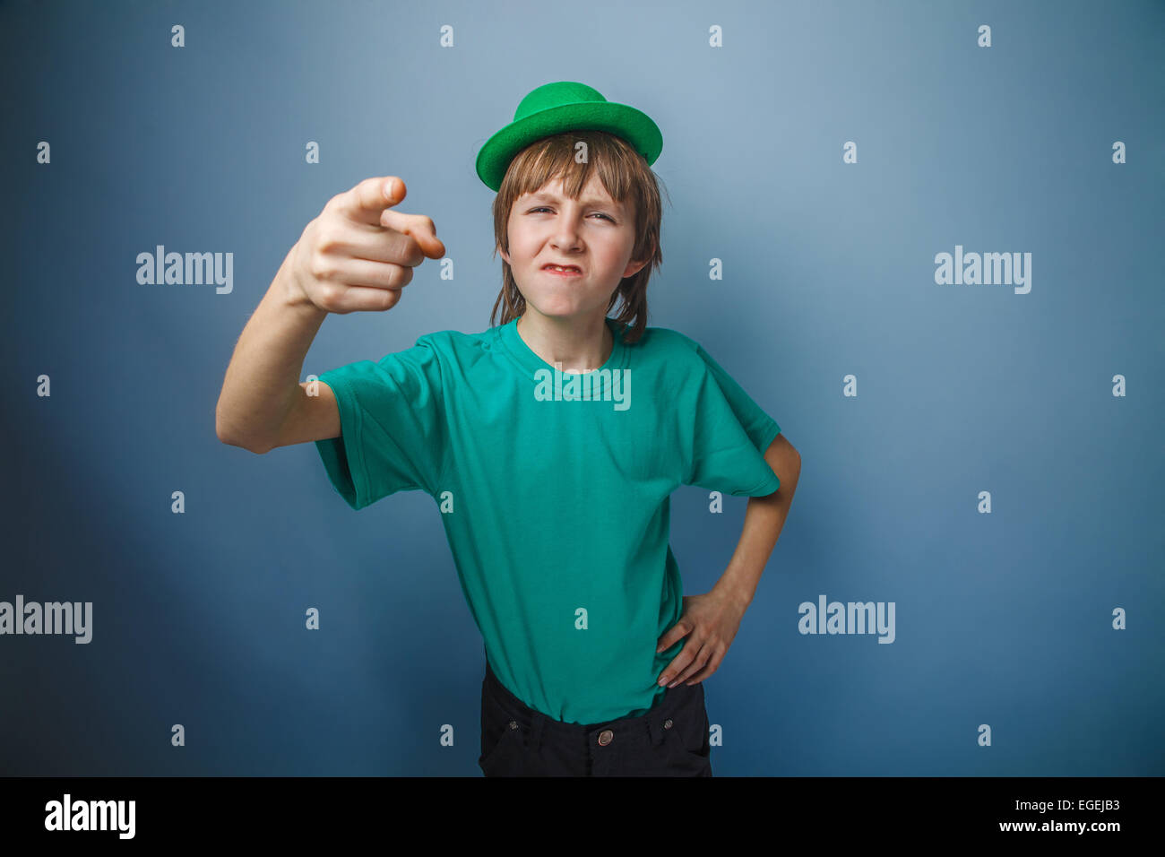 European-looking boy of ten years discontent is pointing at the Stock ...