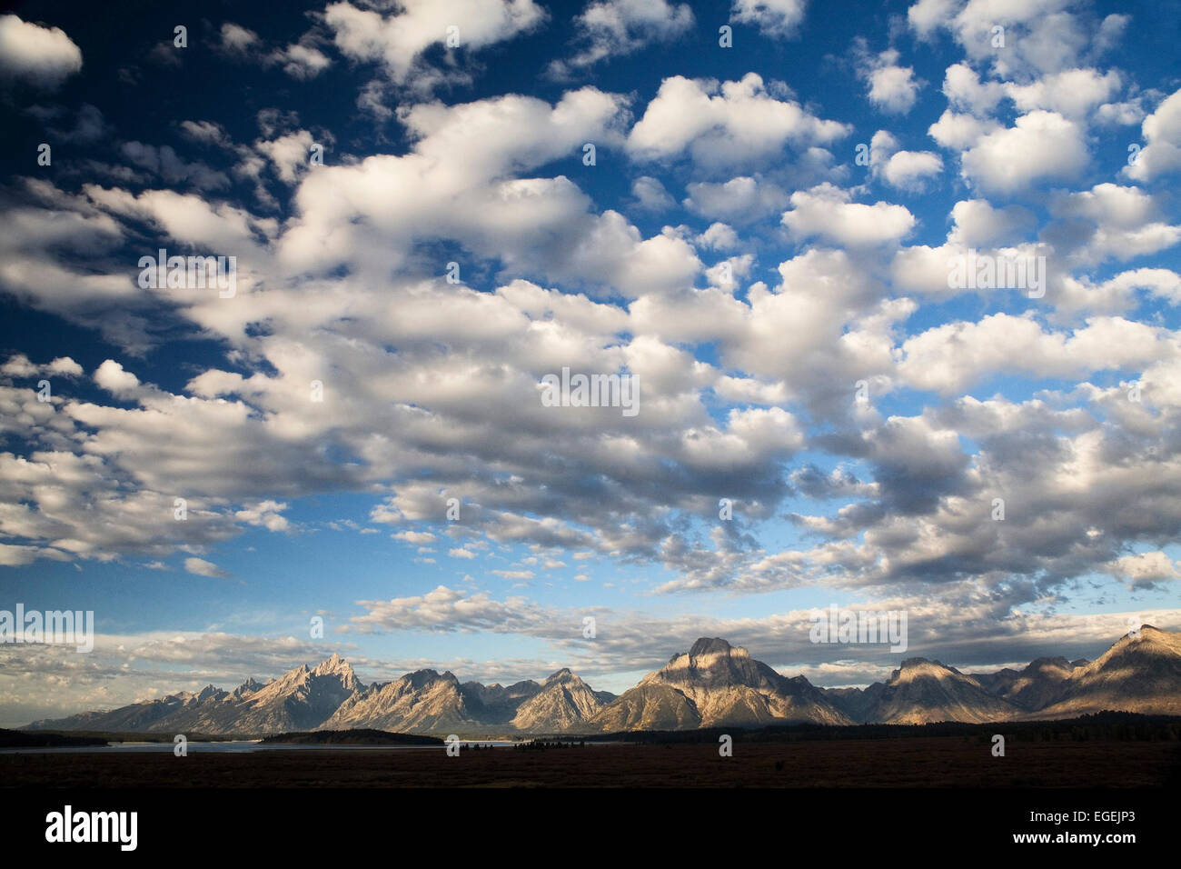 Grand Tetons at sunrise with dramatic cloud formations, Grand Teton National Park, Wyoming Stock Photo