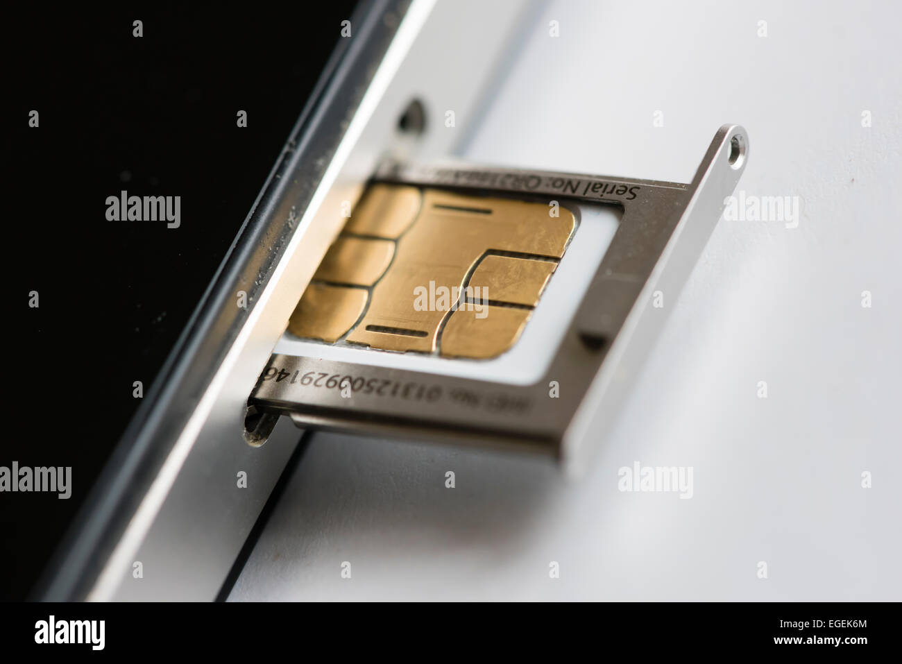 A micro SIM-card is inserted into an Apple iphone 4 smartphone Stock Photo  - Alamy