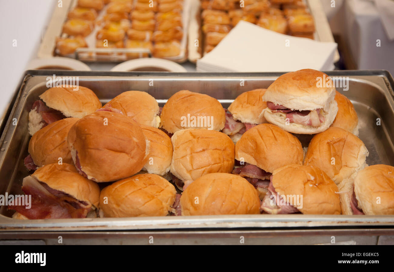 A tray of bacon rolls at an event Stock Photo