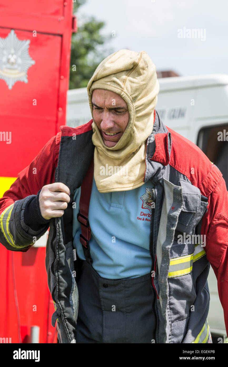 Fire brigade giving chip pan fire demonstration at Carnival