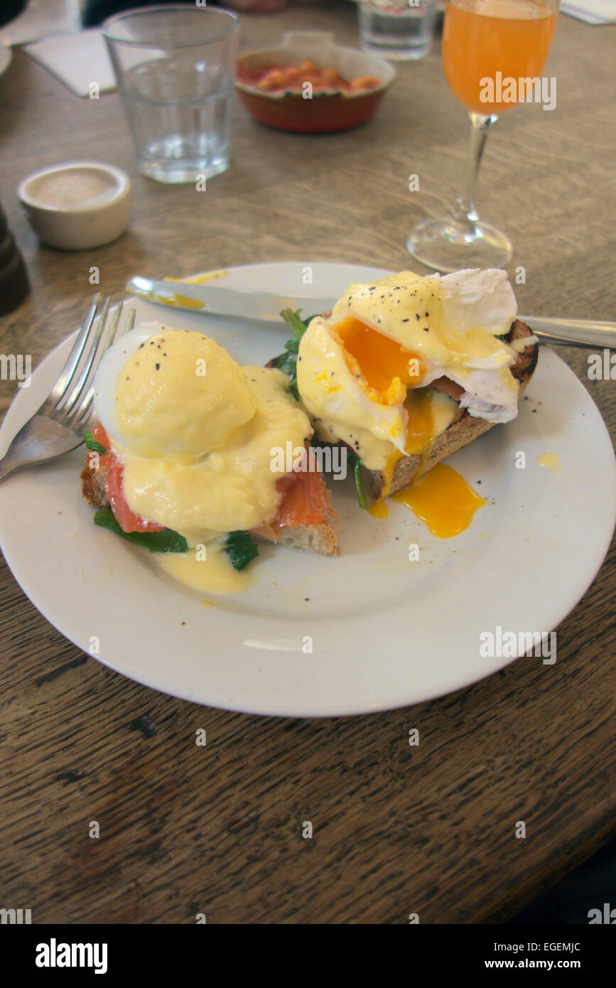 Poached egg with smoked trout and spinach with Hollandaise sauce on