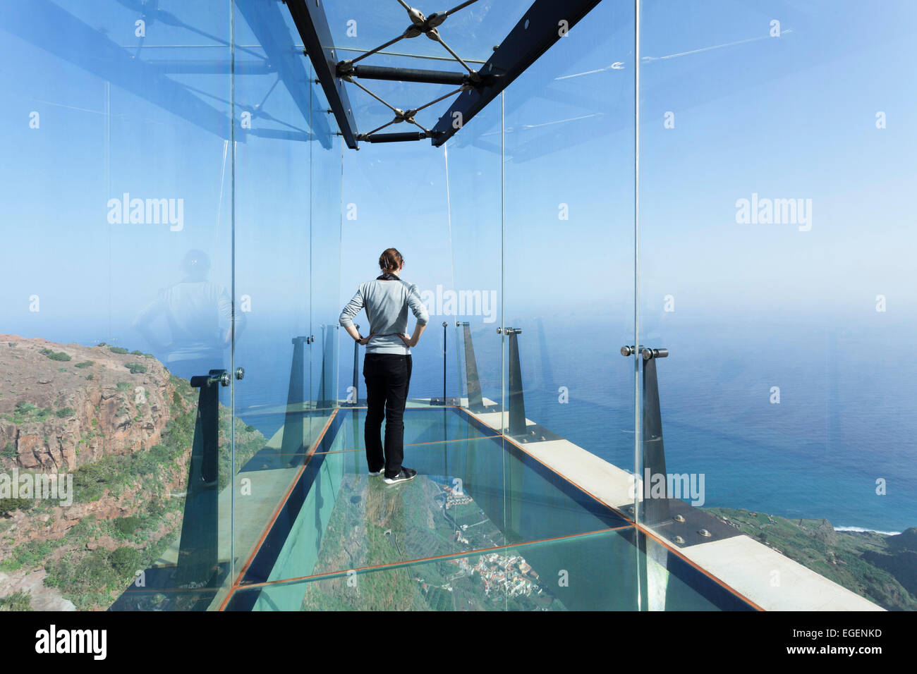 Woman taking in the view of the village of Agulo from the restaurant Mirador de Abrante, La Gomera, Canary Islands, Spain Stock Photo