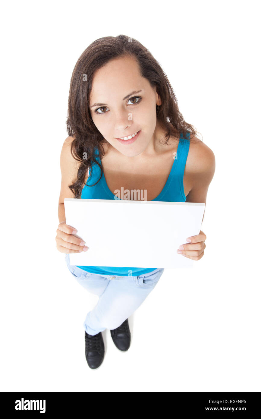 Attractive teenage girl holding blank white sign Stock Photo