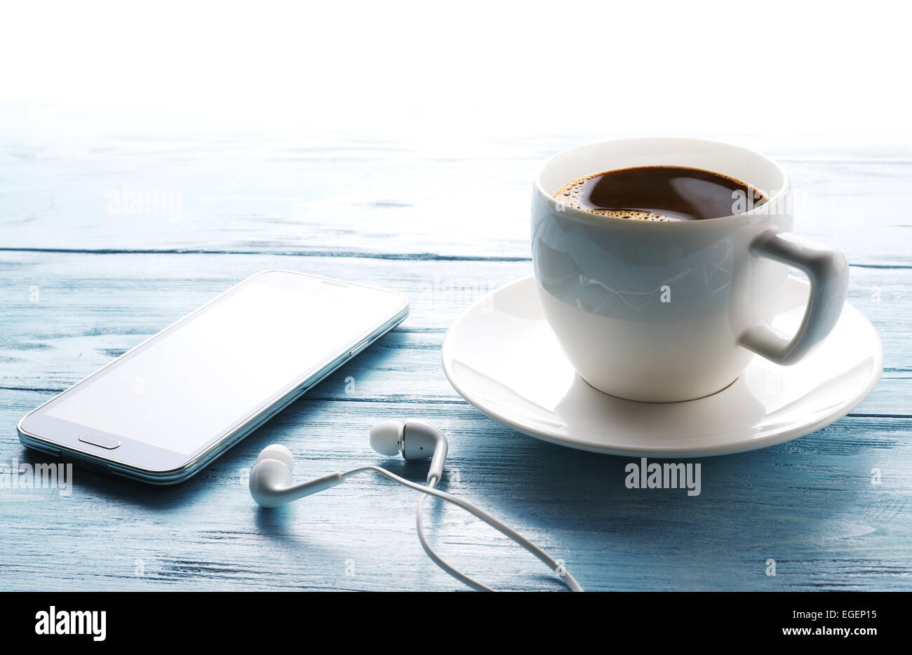 Coffee break. Office table with different gadgets on it. Top view. Stock Photo