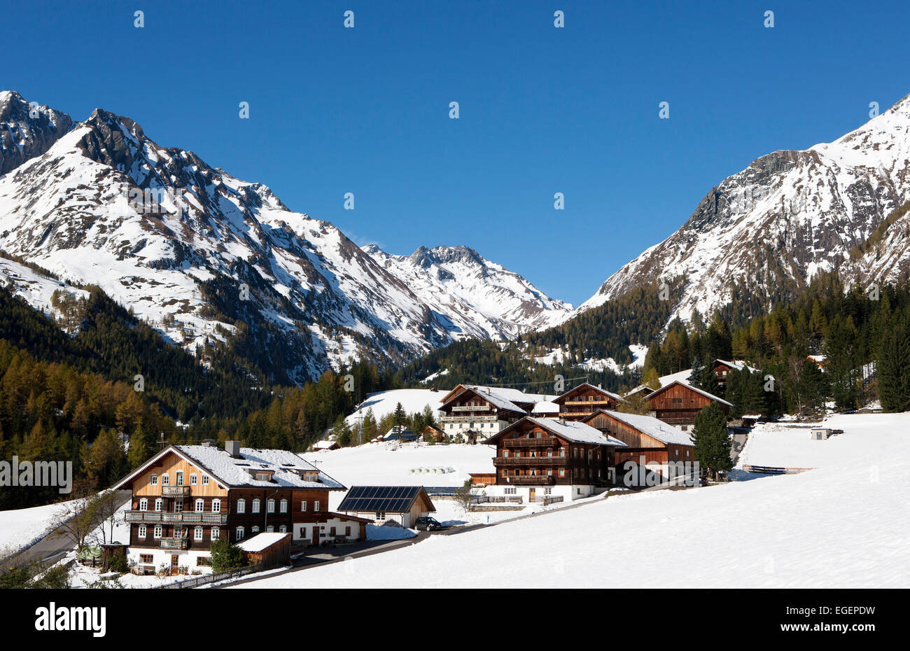 Mountain farms in a snow-capped mountain landscape, High Tauern National Park, Kalser Tal valley, Kals am Großglockner, Tyrol Stock Photo