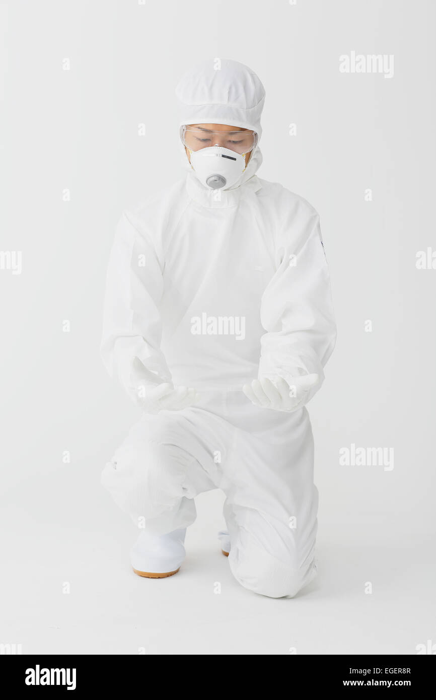 Young Japanese man in a protective suit Stock Photo - Alamy
