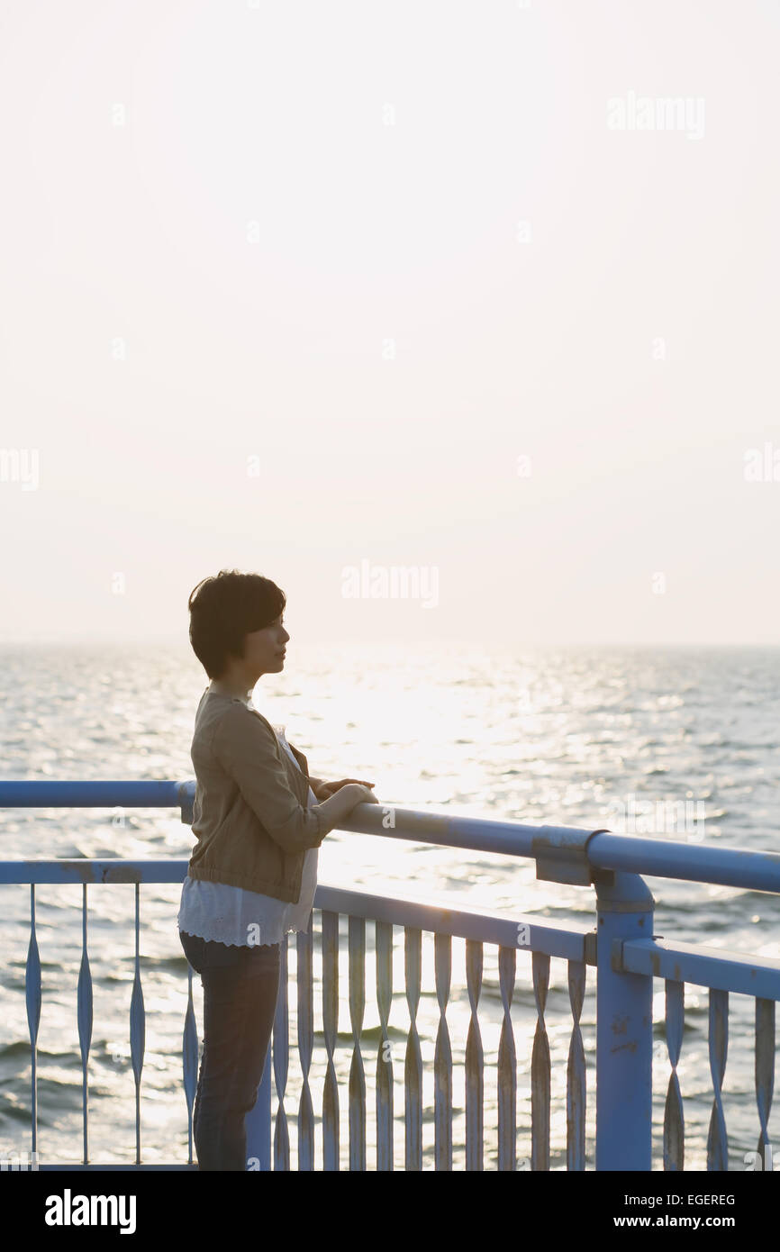 Young Japanese woman by the sea Stock Photo - Alamy