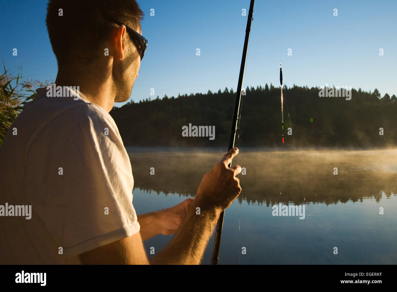 Float fishing on a lake Stock Photo Alamy