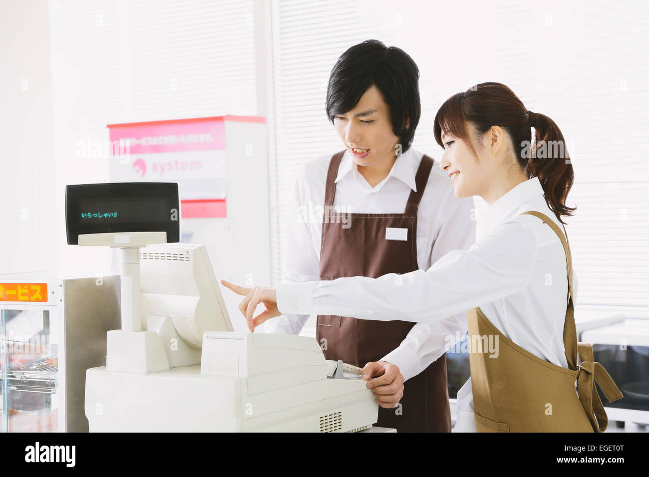 Convenience store staff working Stock Photo