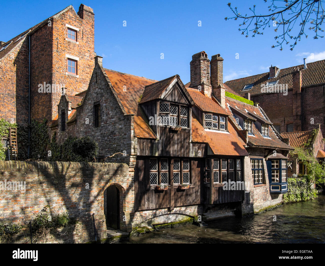 BRUGES, BELGIUM, UK - APRIL 13, 2014:  17C Houses which line many of the canals in Bruges Stock Photo