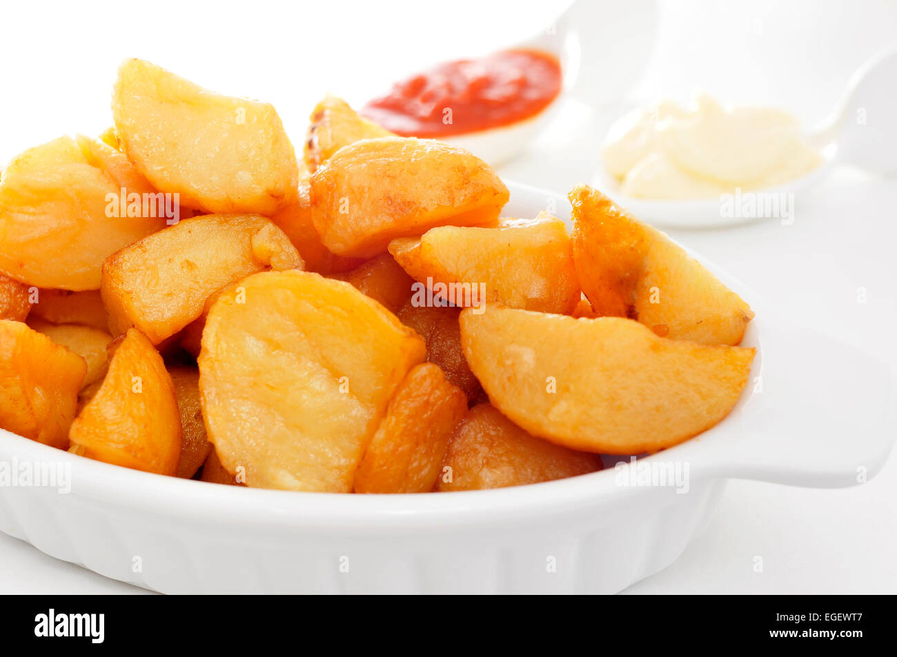 closeup of a plate with typical spanish patatas bravas, fried potatoes with a hot sauce Stock Photo