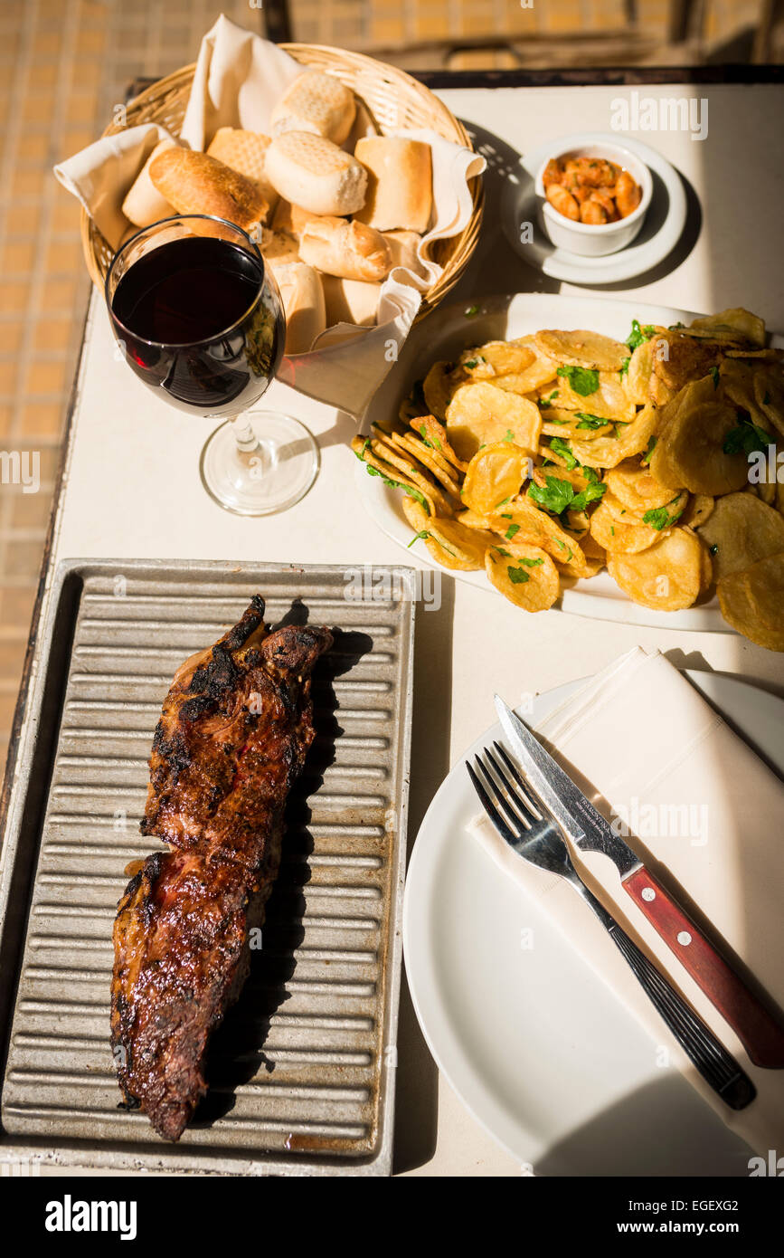 Steak meal at a traditional Parrillia, San Telmo, Buenos Aires, Argentina Stock Photo