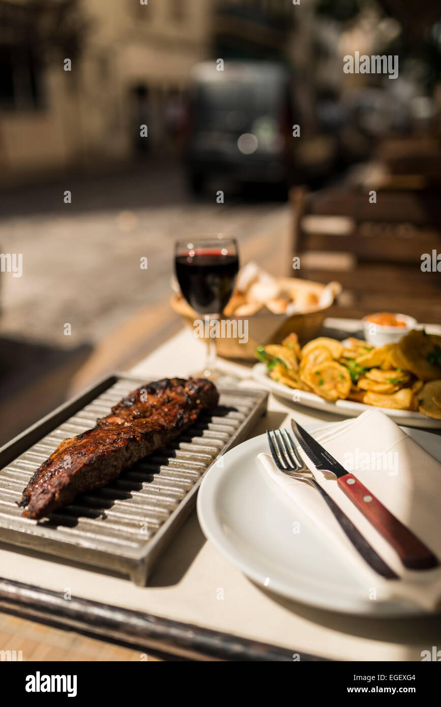 Steak meal at a traditional Parrillia, San Telmo, Buenos Aires, Argentina Stock Photo