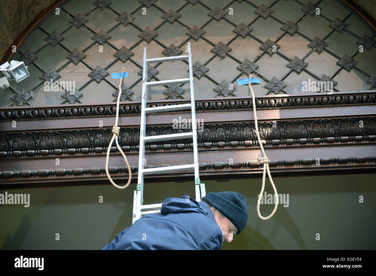 Prague, Czech Republic. 20th Feb, 2015. Anti-communist protest event outside Communists (KSCM) seat took place in Prague, Czech Republic, February 20, 2015. Volunteers installed gallows nooses at the entrance to the Communist Party headquarters to symbolically express their disagreement with the exhibition of former North Korean leader Kim Jong Il organized by the first deputy chairman of KSCM Petr Simunek in the headquarters of the Communists. © Michal Dolezal/CTK Photo/Alamy Live News Stock Photo