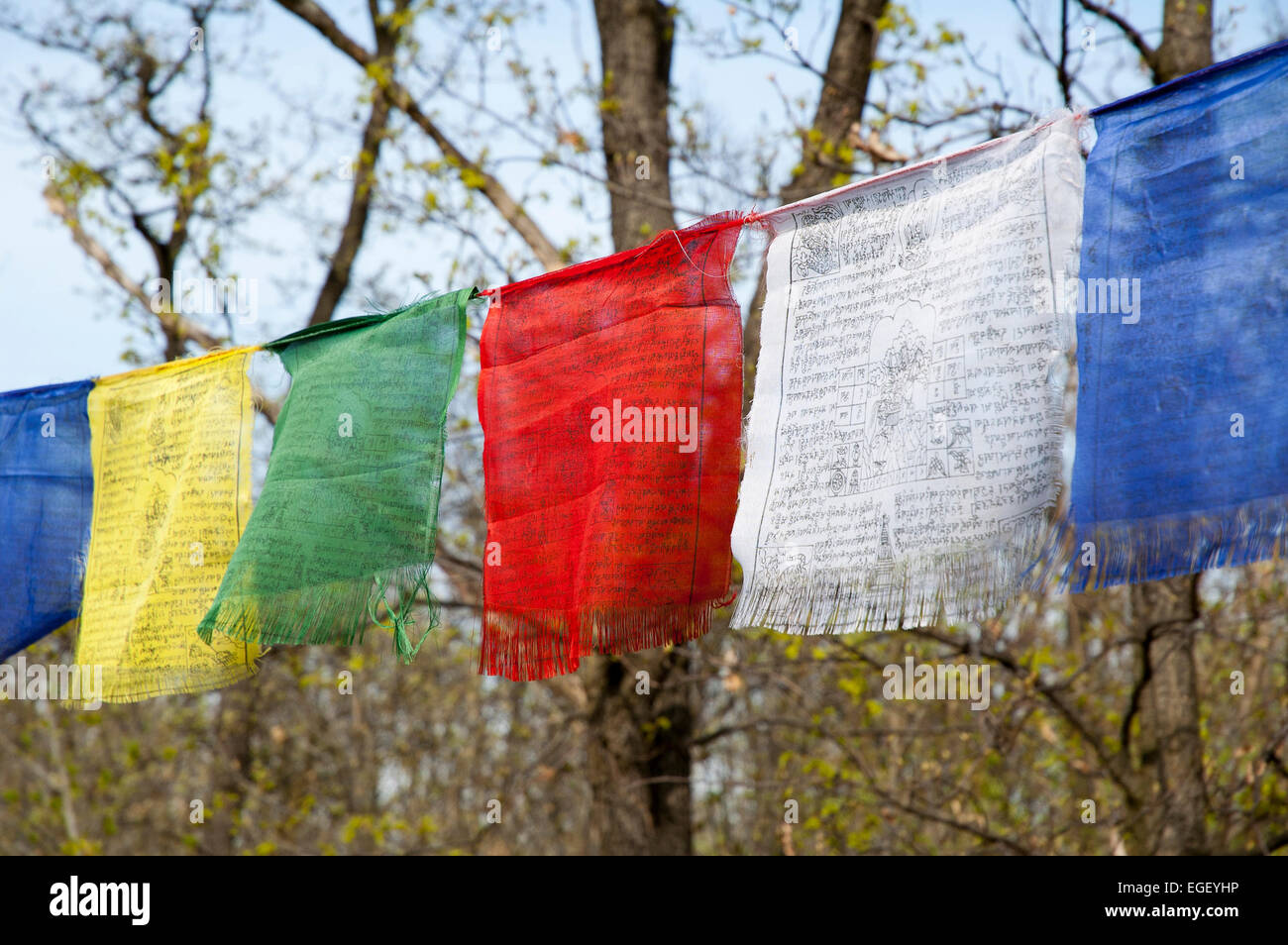 Tibetan prayer flags with ancient buddhism symbols and prayers written