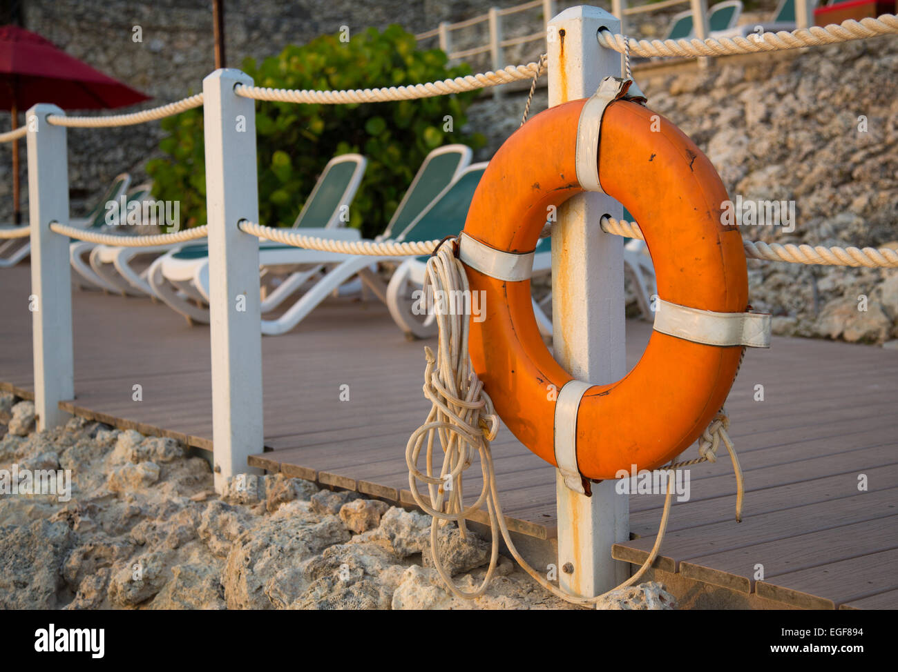 Life rings stand at the ready along the beach at a Caribbean resort. Stock Photo