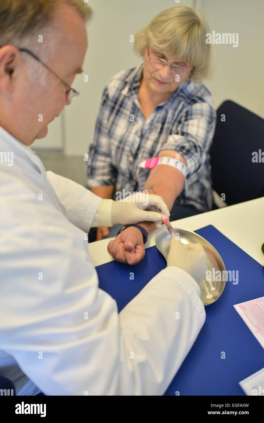 The family doctor – here in his surgery – fulfils an important task in the health system, whether during consultation or home vi Stock Photo