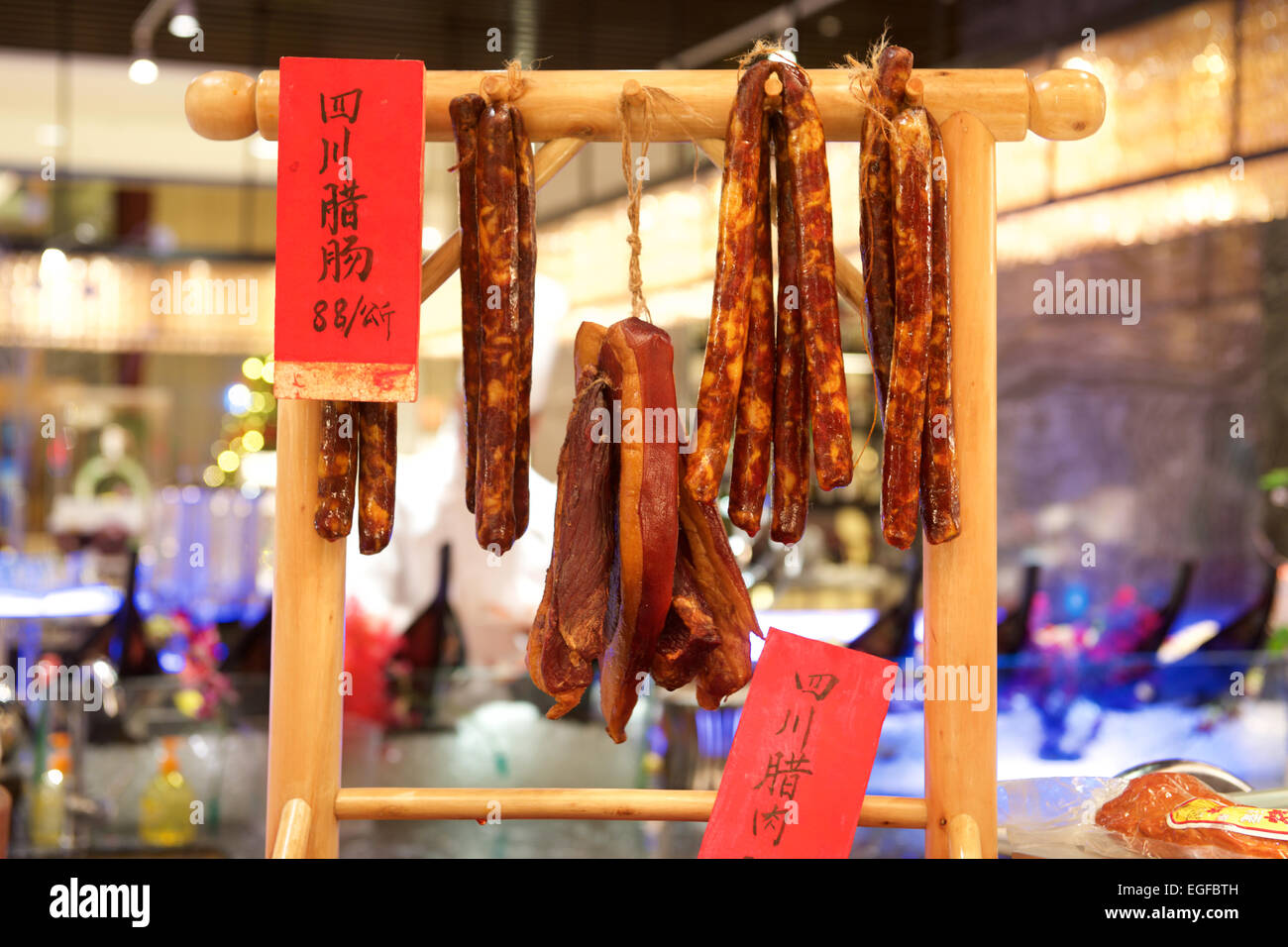 Chinese sausage hanging on a stand for sale Stock Photo