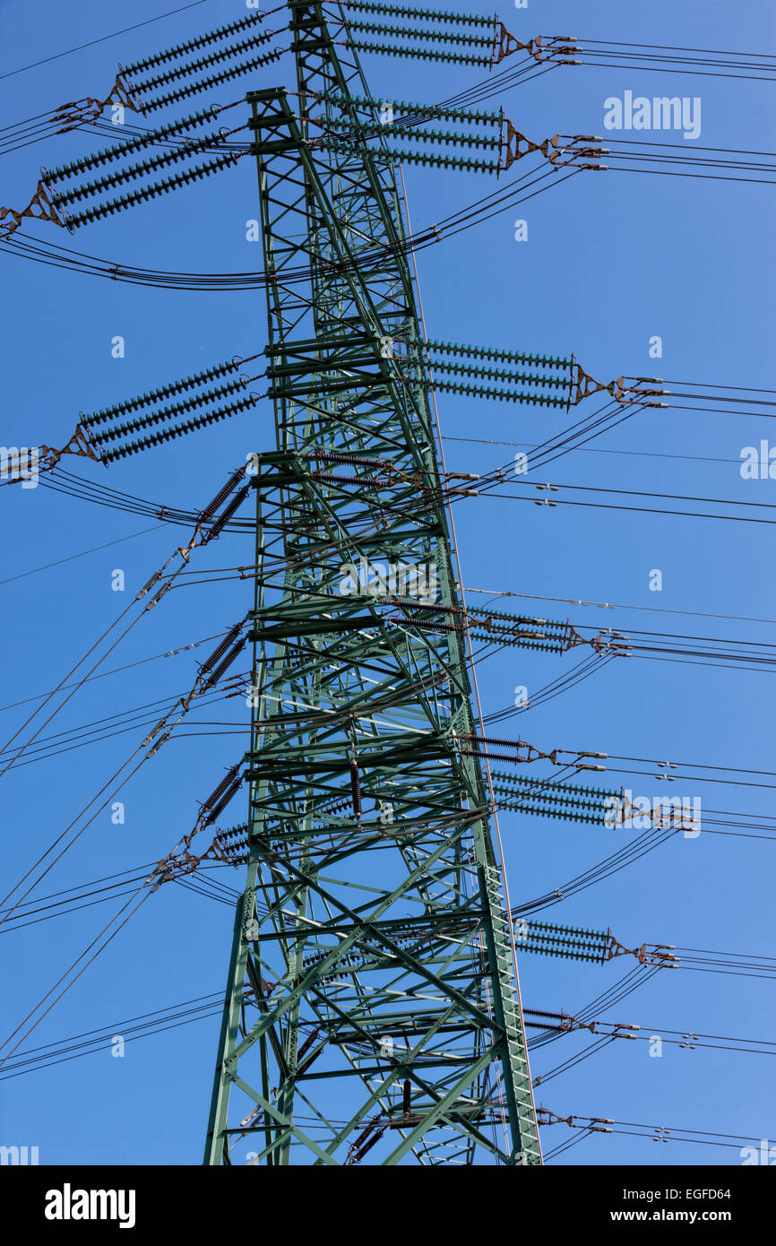 Electricity pylon against blue sky Stock Photo - Alamy