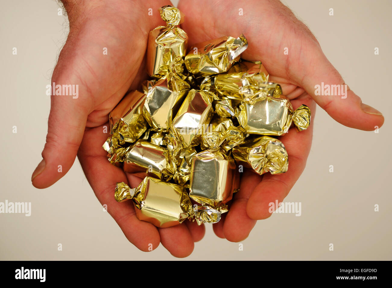 Male Holding Toffee Sweets Stock Photo - Alamy