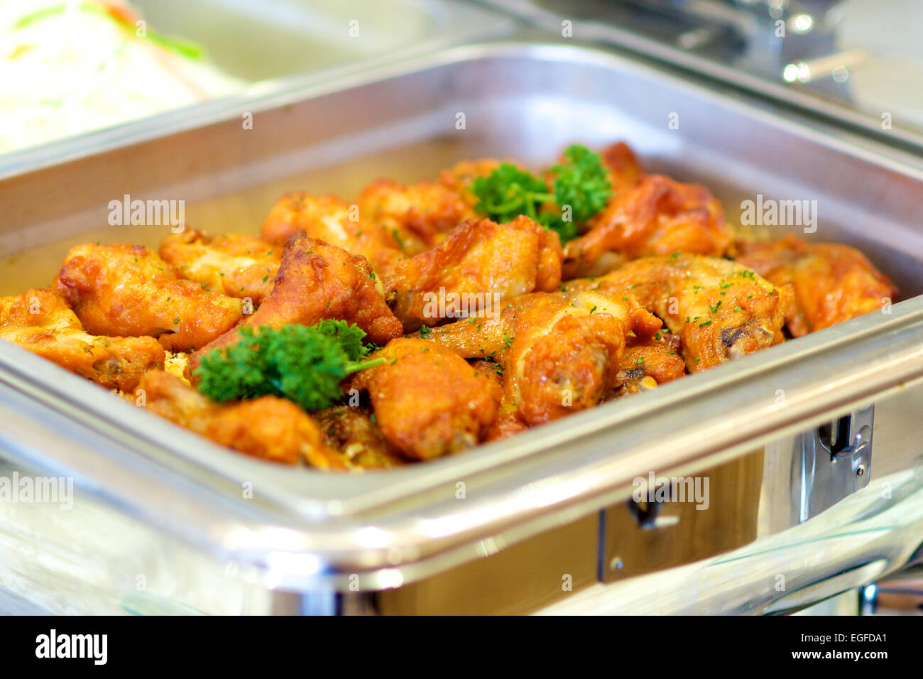 chicken wings and drumstick in warming trays for buffet line Stock Photo