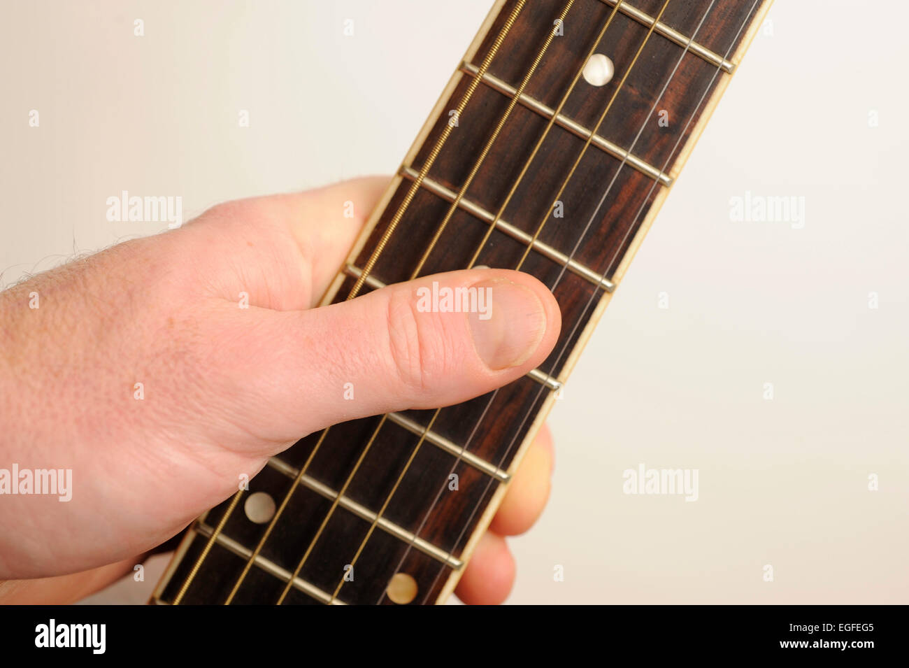 Male Holding a Fret board Stock Photo